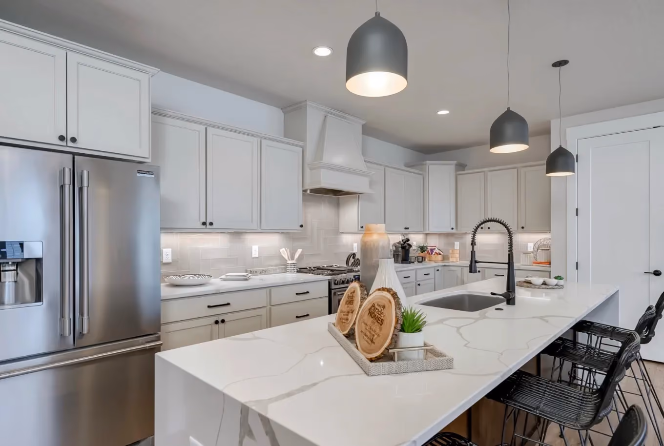 Open-concept kitchen with quartz island