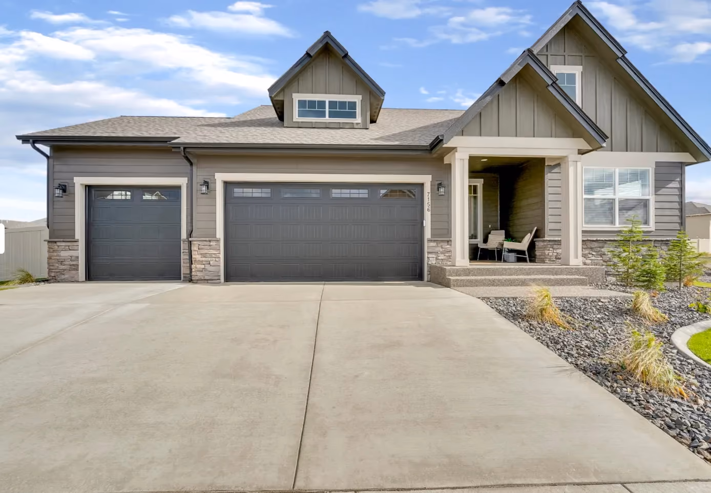 Single-level craftsman home with three-car garage