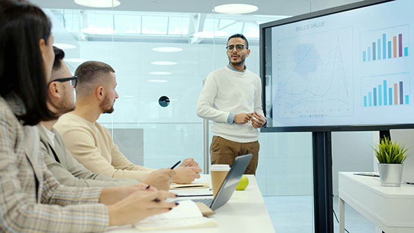 Photo of a person doing financial presentation, by Vitaly Gariev.