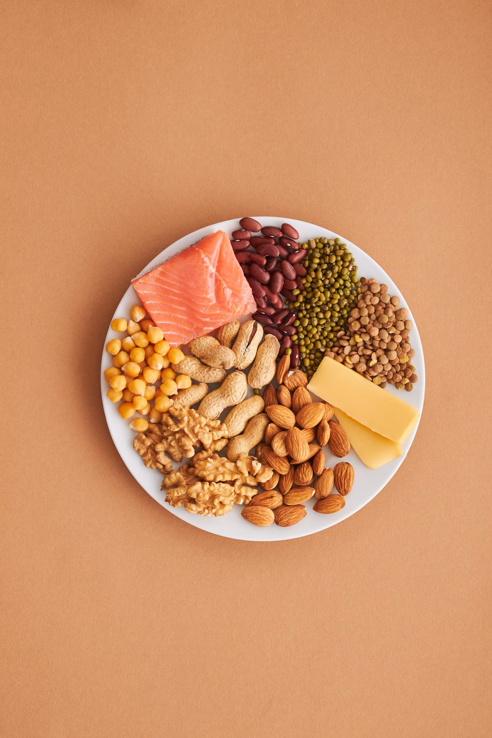 Plate of common food allergens including nuts, fish and dairy