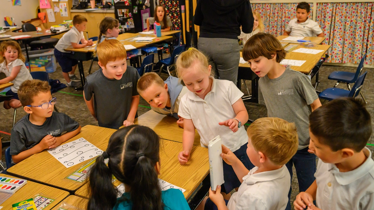 Young students working together at their desks at St. Joseph Marquette Catholic School in Yakima