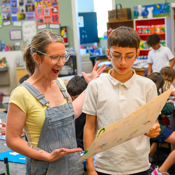 A teacher helping a student at St. Joseph Marquette Catholic School in Yakima