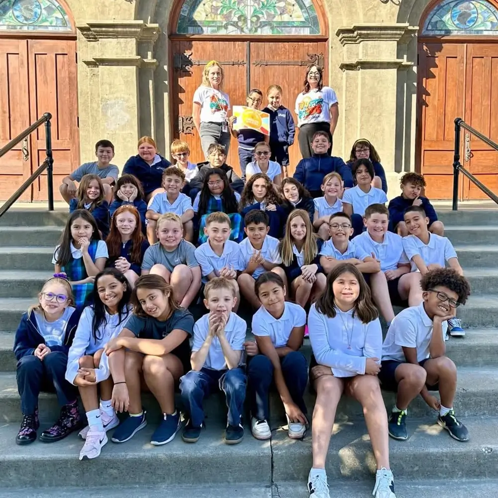 Students gathered on the church steps at St. Joseph Marquette Catholic School in Yakima