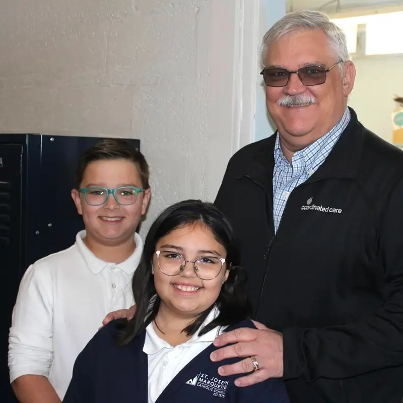 A family in the school hallway at St. Joseph Marquette Catholic School in Yakima