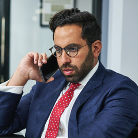 Arash Law attorney on a call with a car accident client