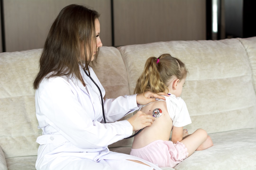 nurse examining child