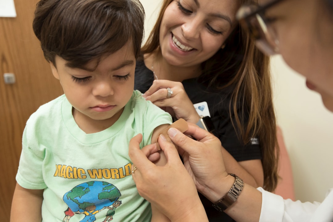 pediatrician examining child ear