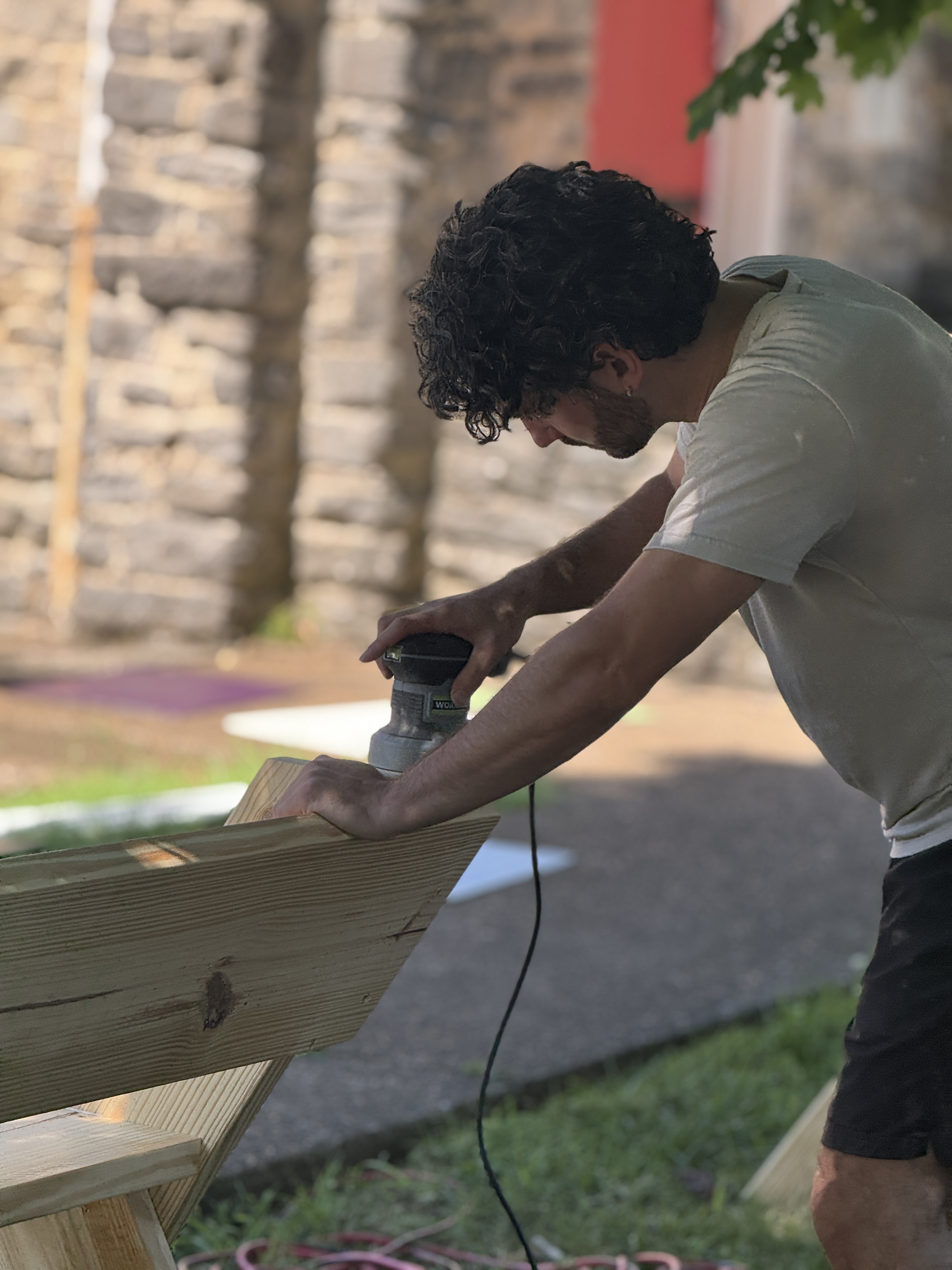 Photograph of Candidate for Governor Dave Seeman sanding a bench for To Nashville With Love
