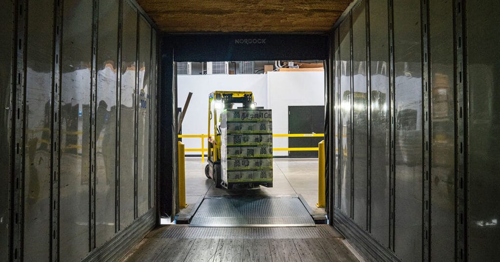 A shipping container being loaded with goods