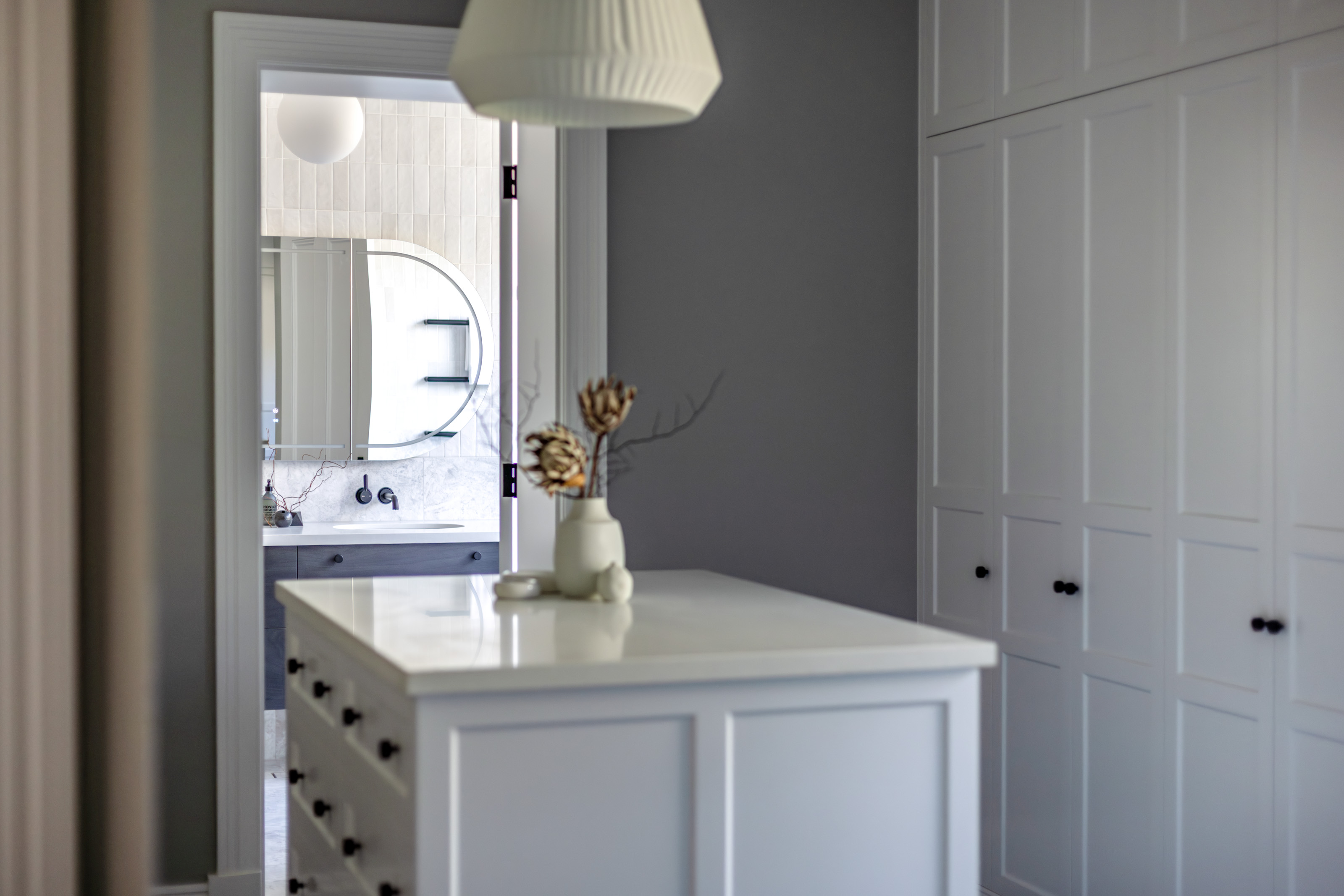 Dressing room with central island and fitted joinery at 54 North Adelaide.
