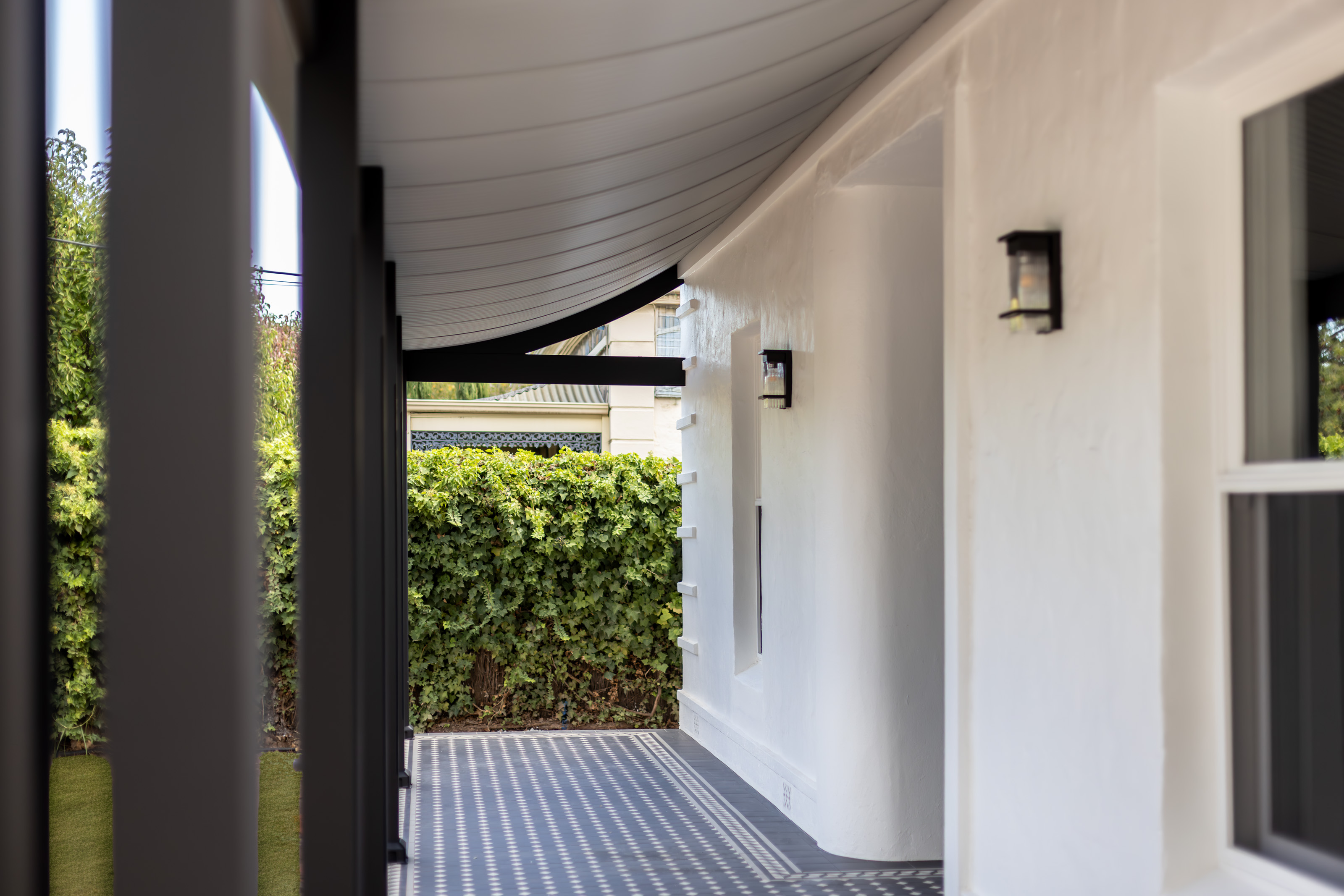 Side passage between the villa and the rear addition at 54 North Adelaide.