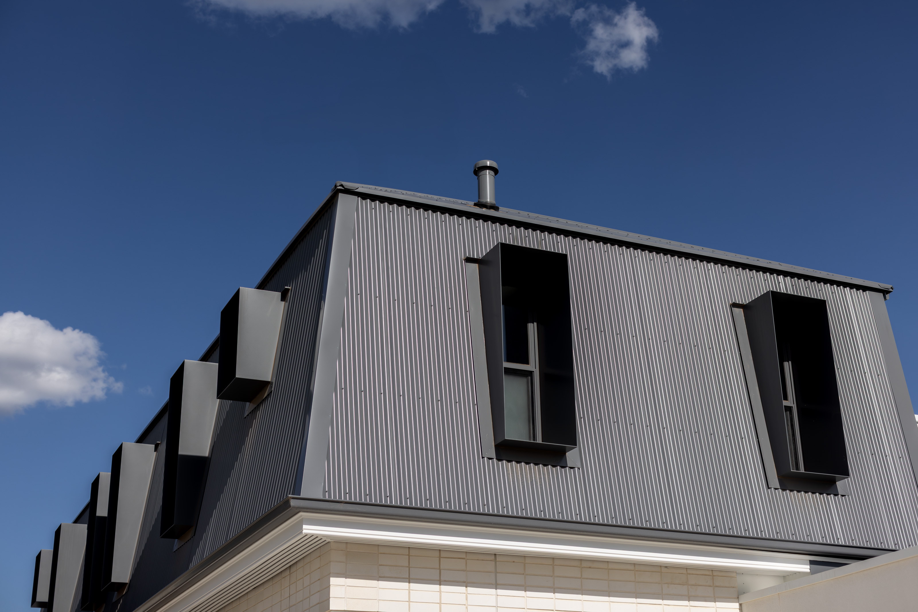Metal-clad gable and window detail of the rear addition at 54 North Adelaide.