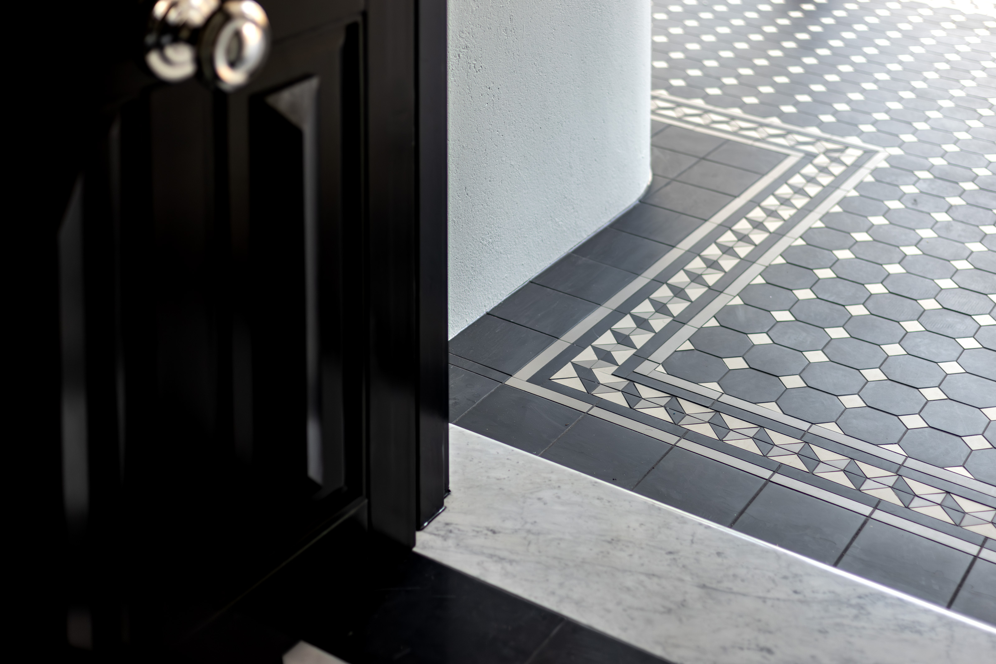Retained panelled door and tessellated heritage tile floor at 54 North Adelaide