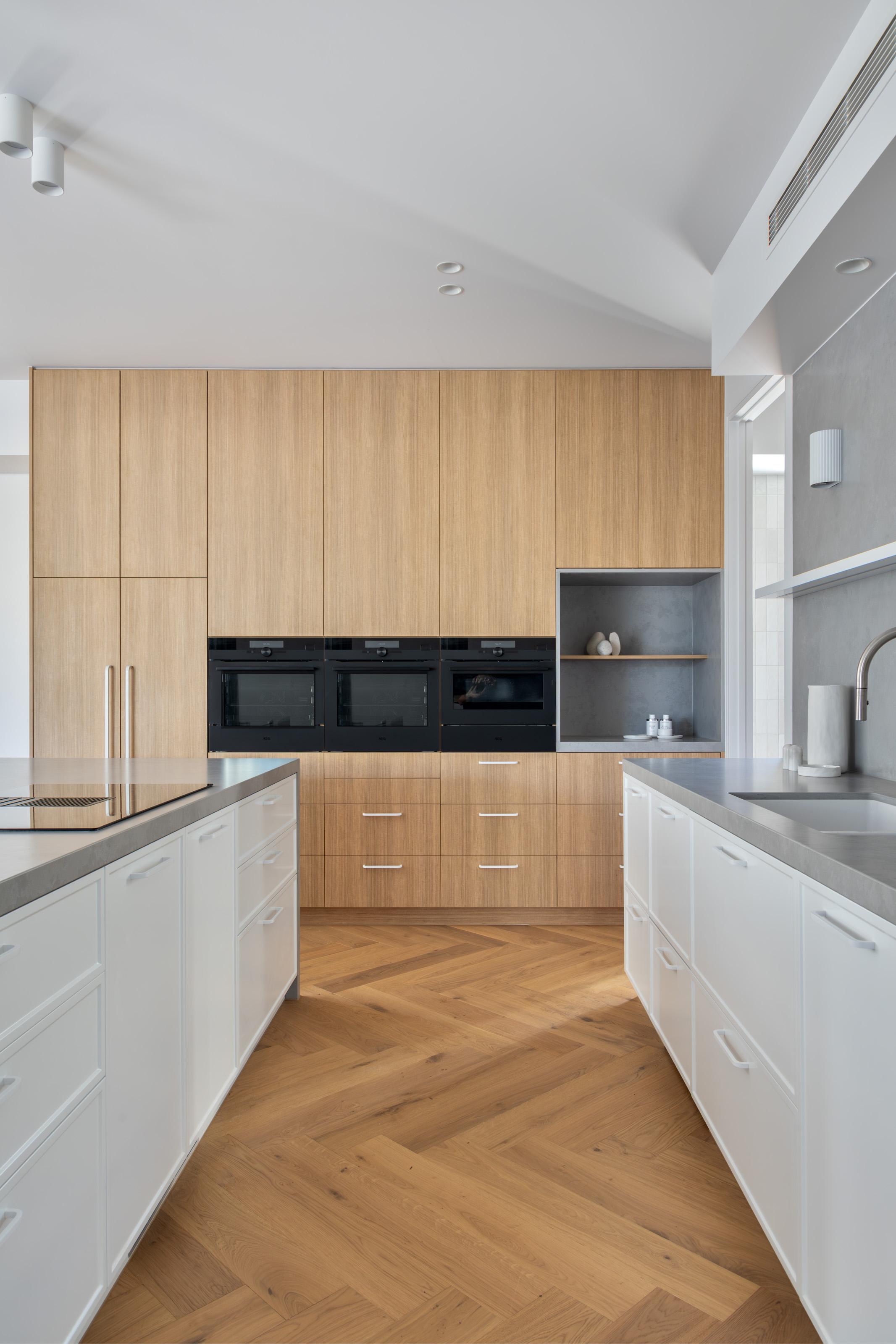 New kitchen with timber joinery and herringbone oak floor in the addition at 54 North Adelaide