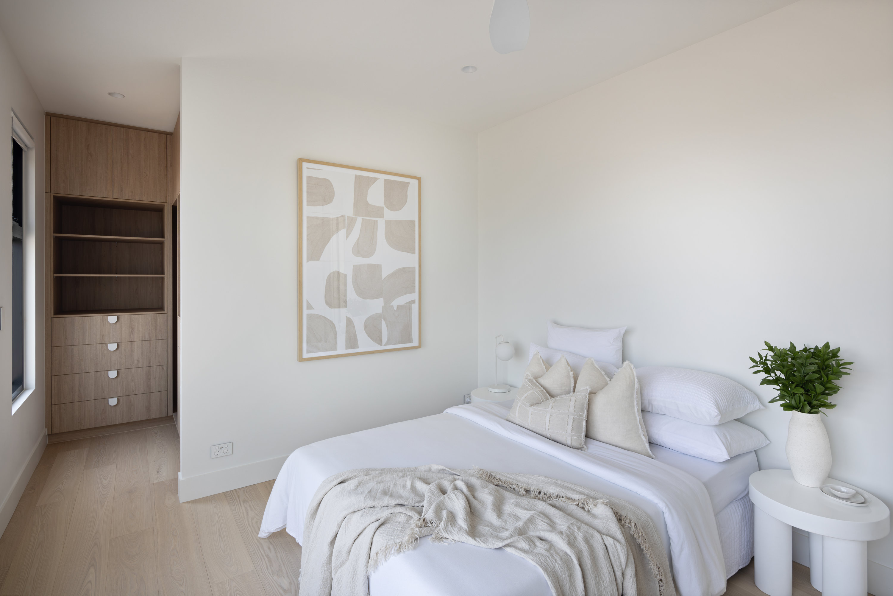 Bedroom with oak built-in wardrobe and shelving at 9 Netherby