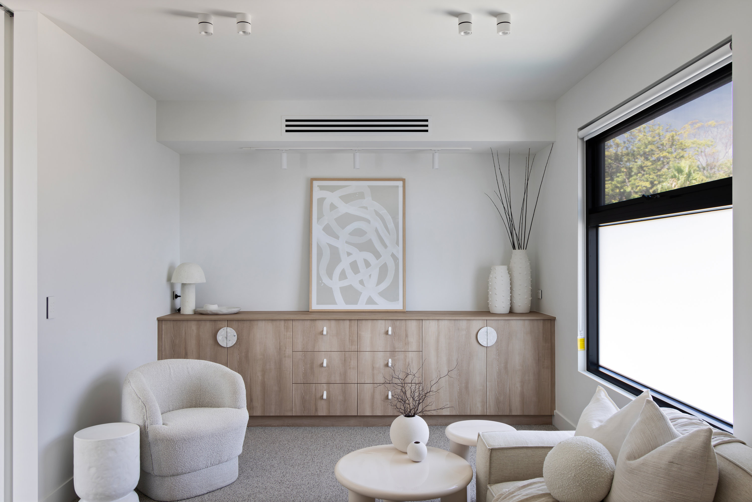 Upstairs sitting room with oak sideboard and a large picture window at 9 Netherby