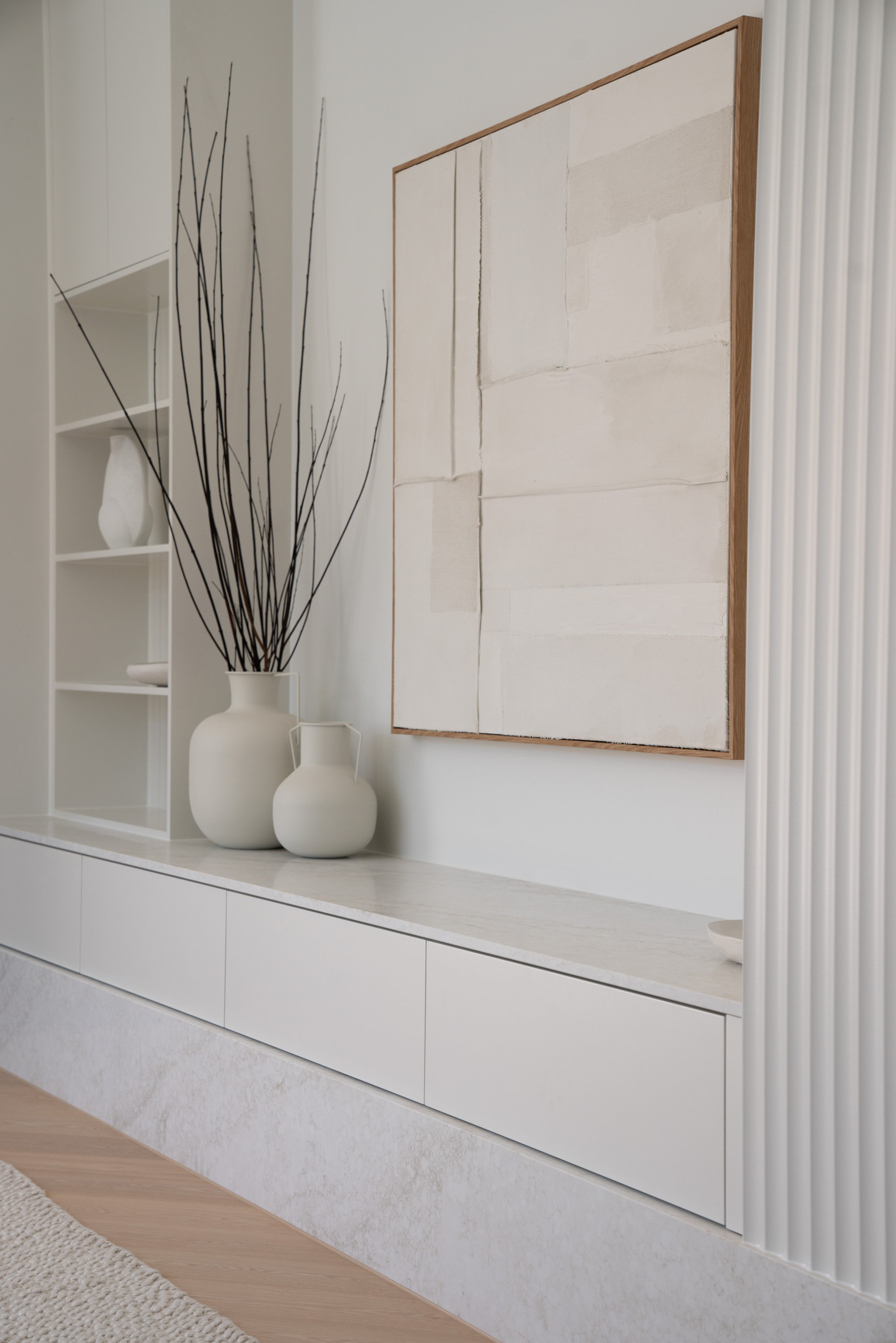 Built-in living room cabinetry with stone top and fluted detailing at 9 Netherby