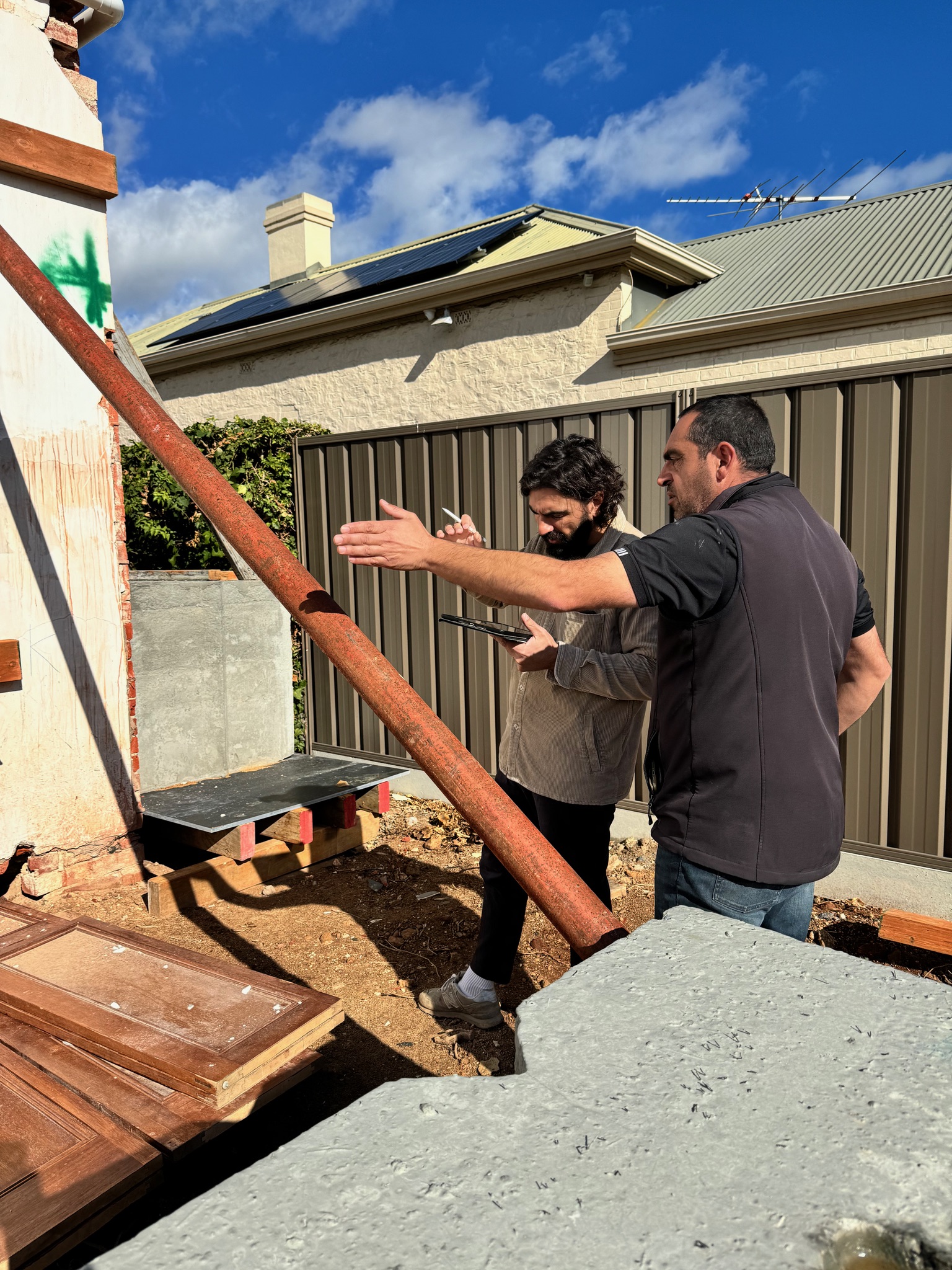 Anthony reviewing structural works on site during construction at 54 North Adelaide