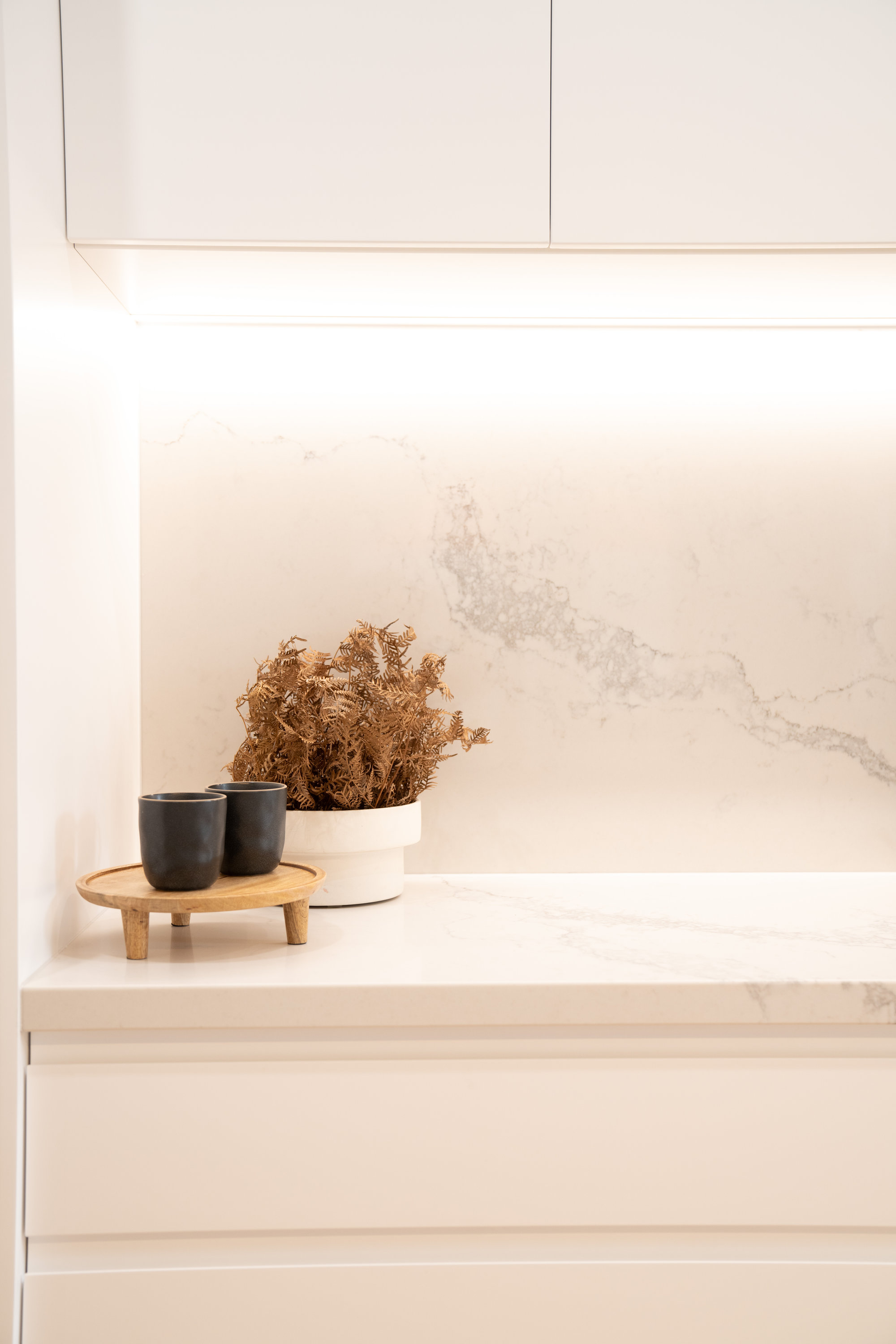 Marble splashback and stone benchtop detail with concealed lighting at 24 Wattle Park