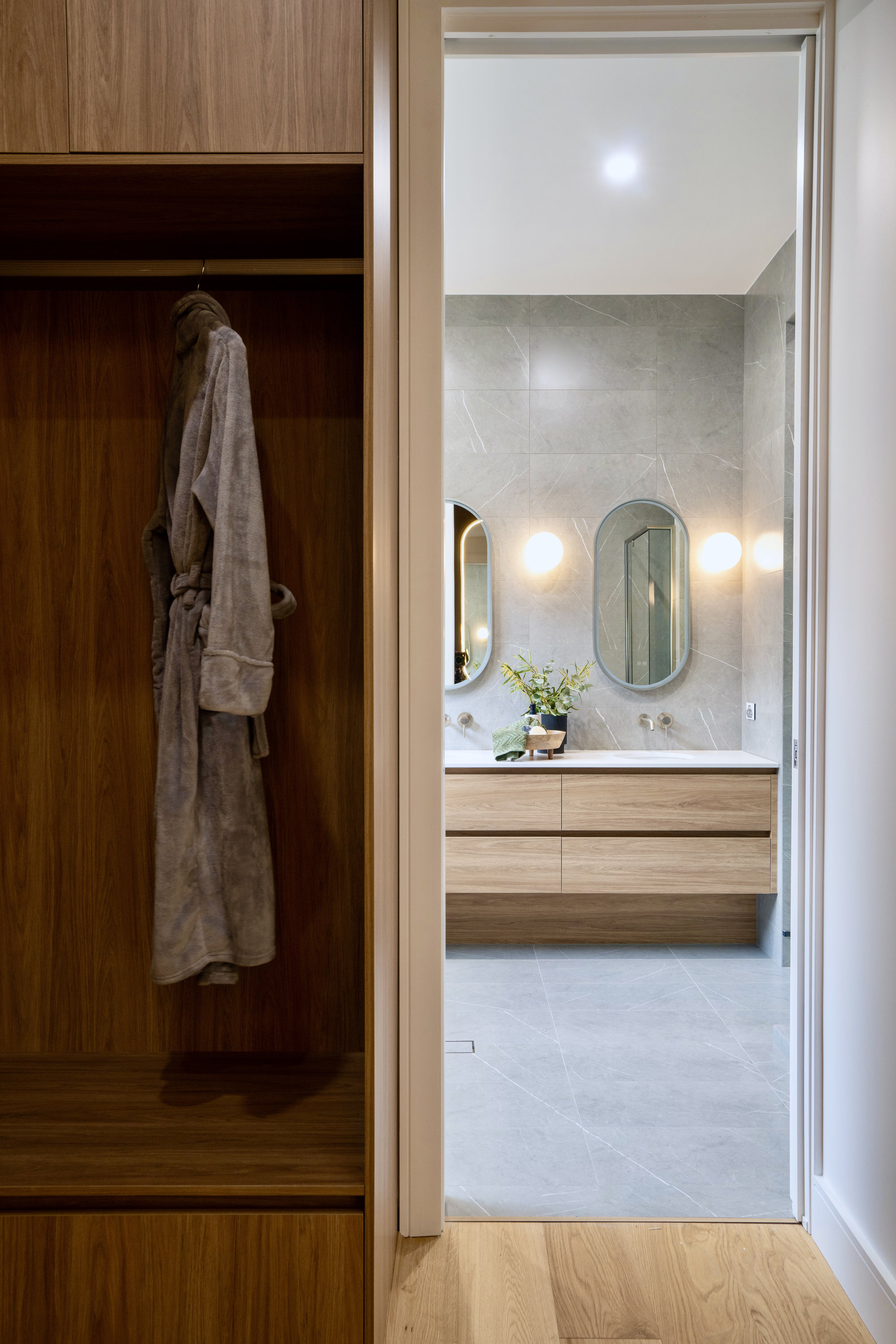 Walk-in robe with timber joinery opening to the ensuite at 24 Wattle Park