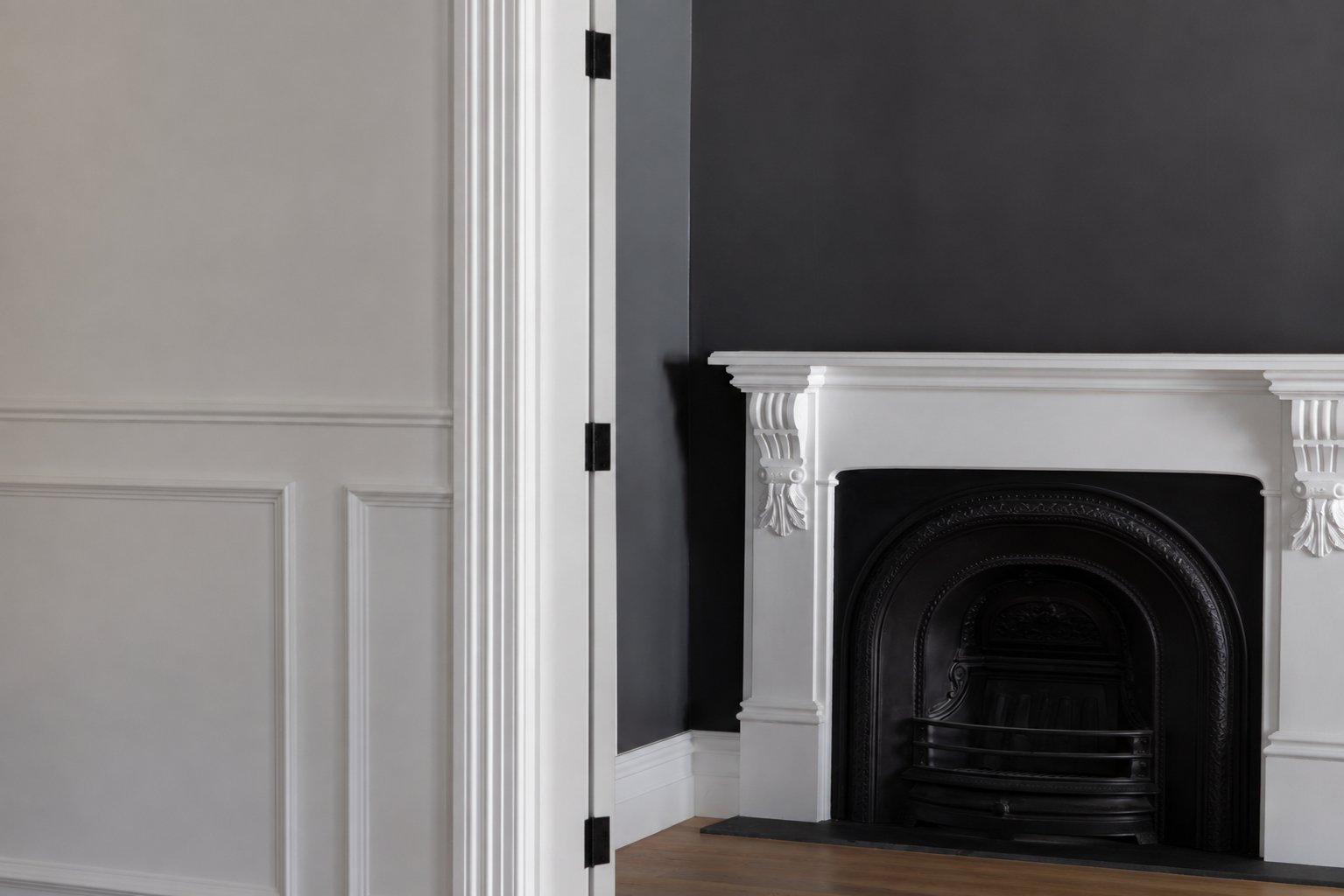 Restored fireplace with white mantel and panelled wall at 54 North Adelaide.
