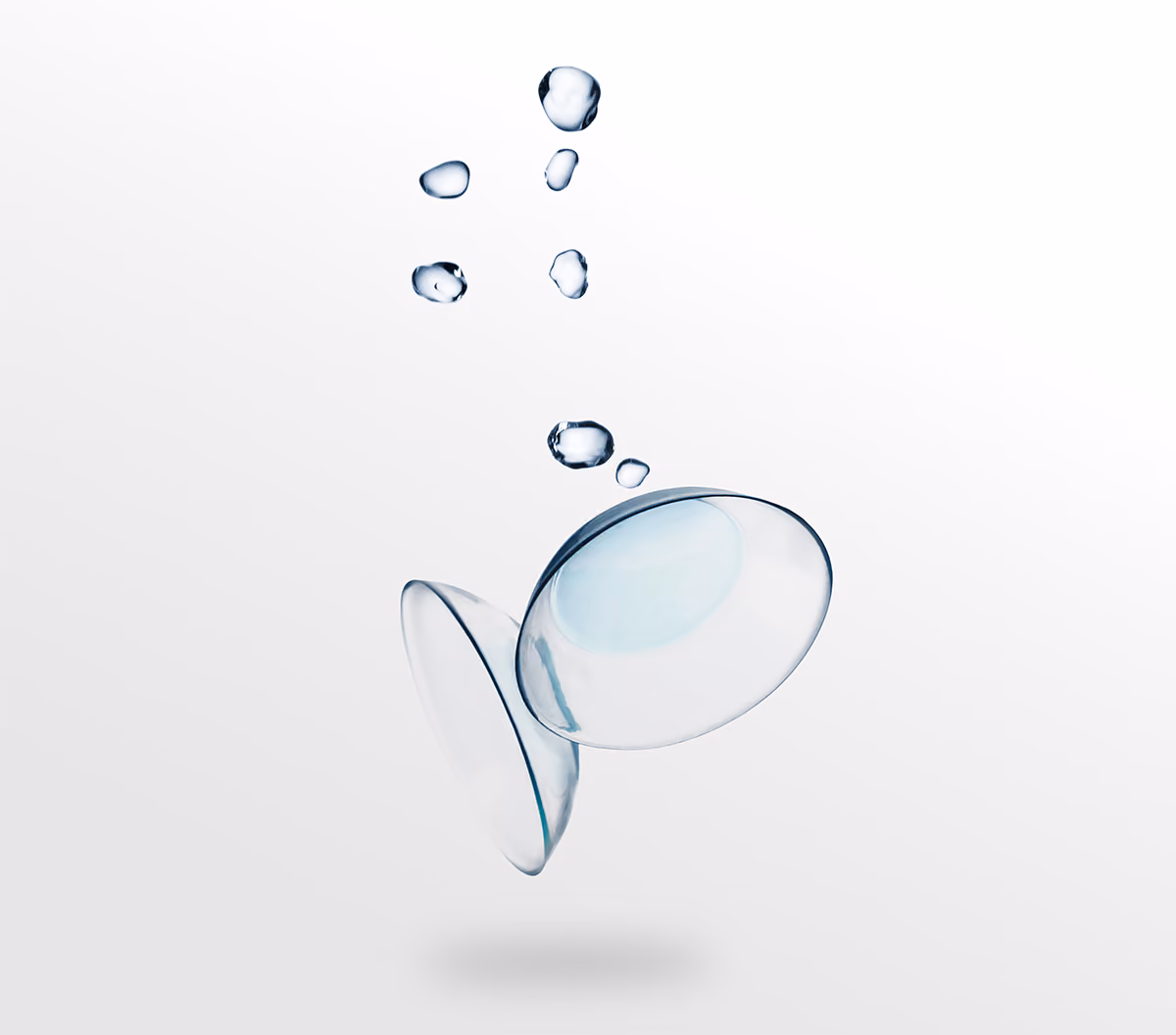 Contact lenses with water droplets, showing surface wettability