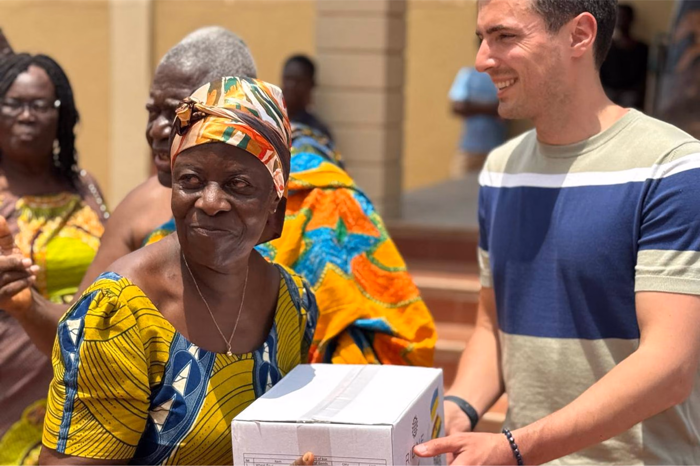 Woman receiving a humanitarian food package from Serhiy Kovalchuk