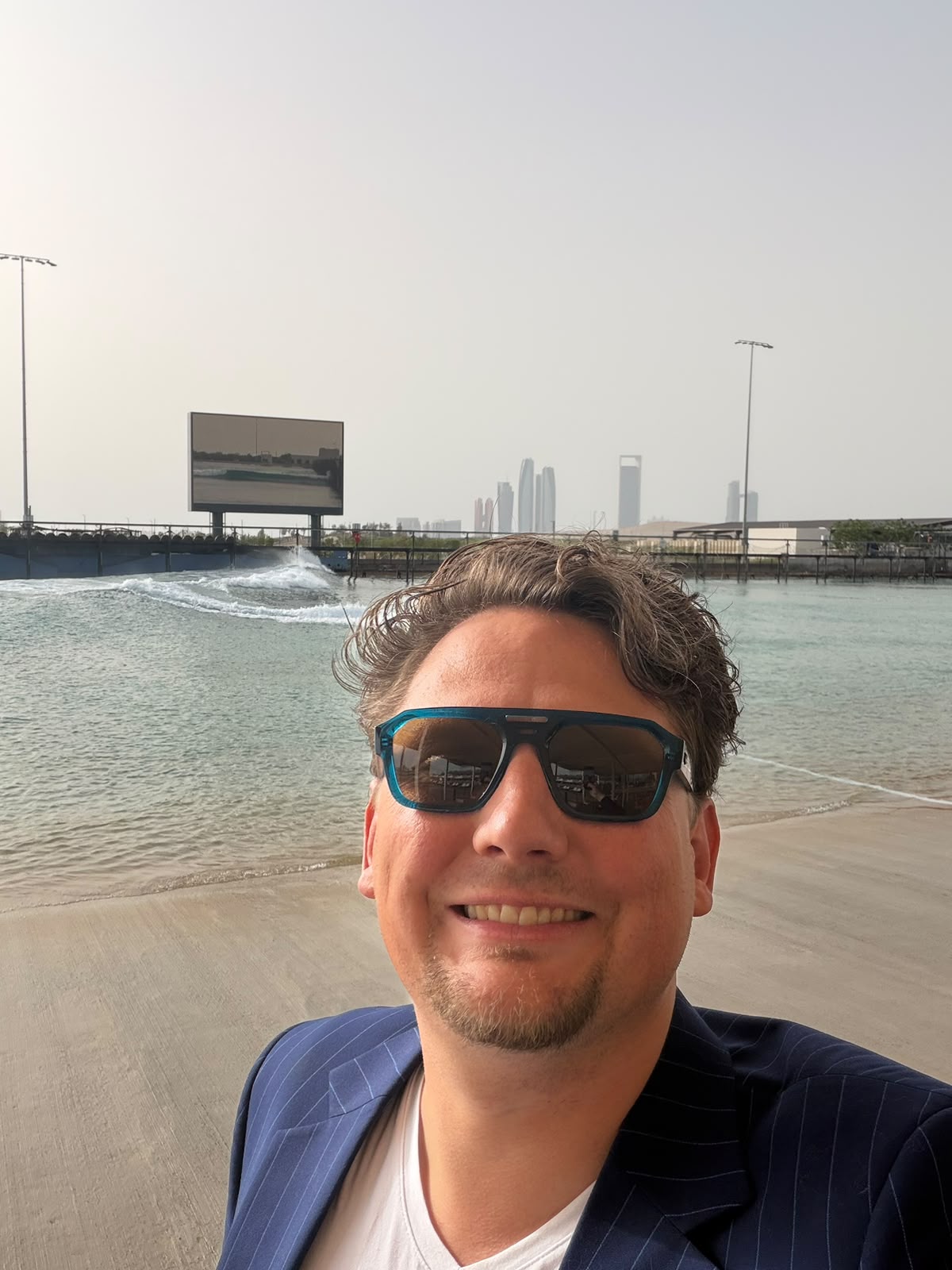 Jasper Roode on the Hudayriyat Island beachfront, with the Abu Dhabi skyline in the background