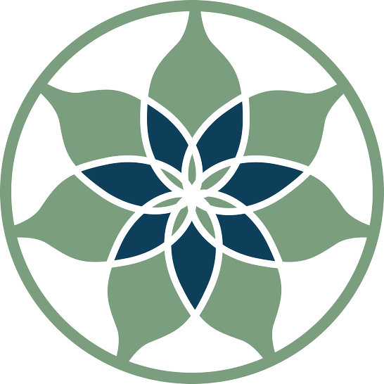 Circular mandala made of six green and blue layered leaf shapes arranged symmetrically.