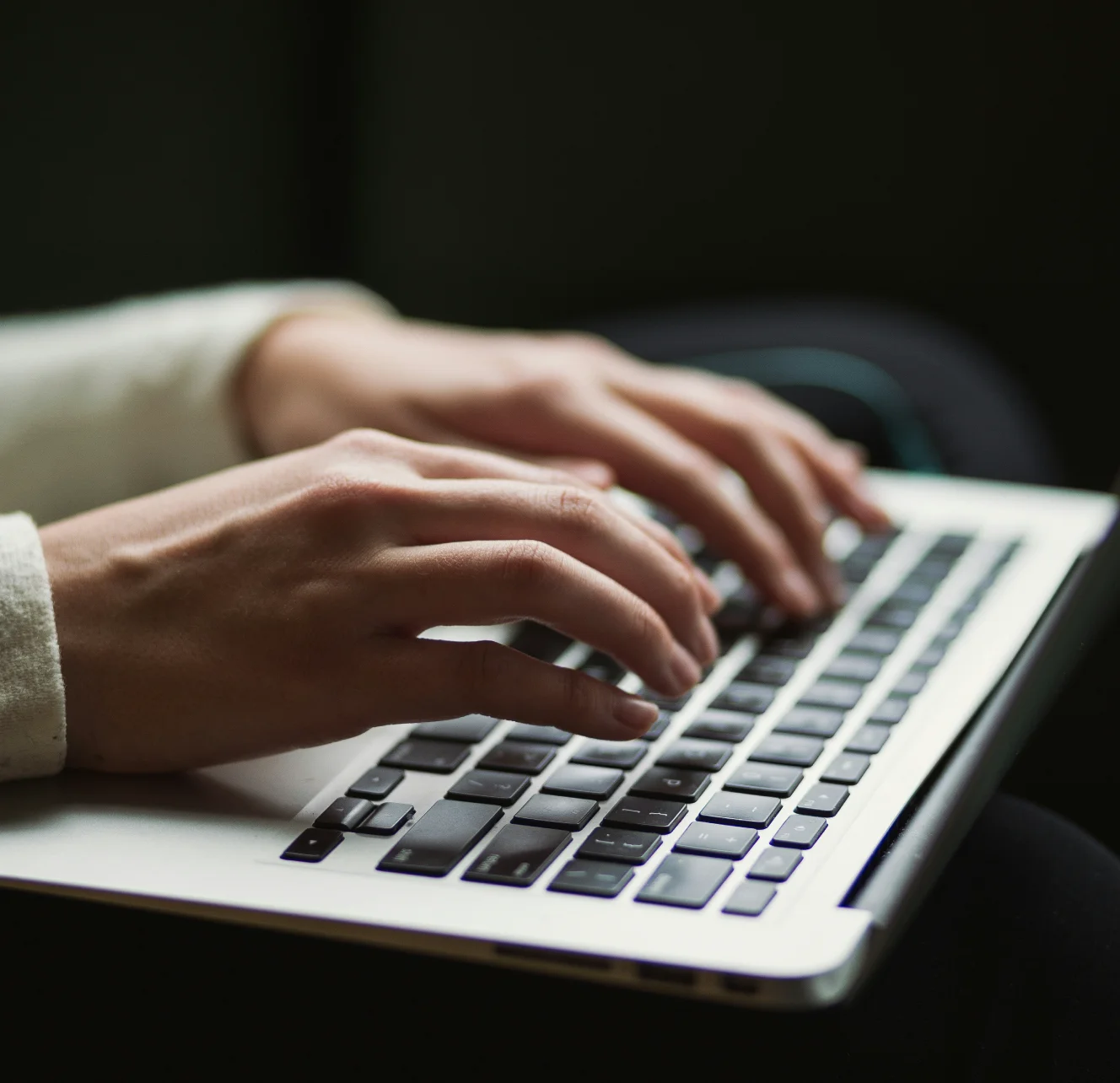 Person typing on a laptop
