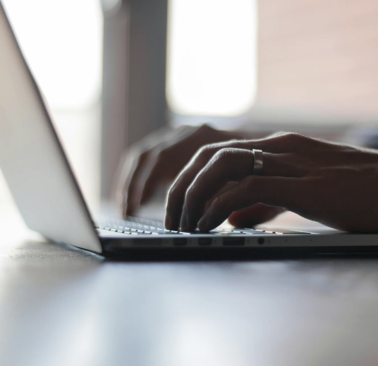 Person typing on an laptop