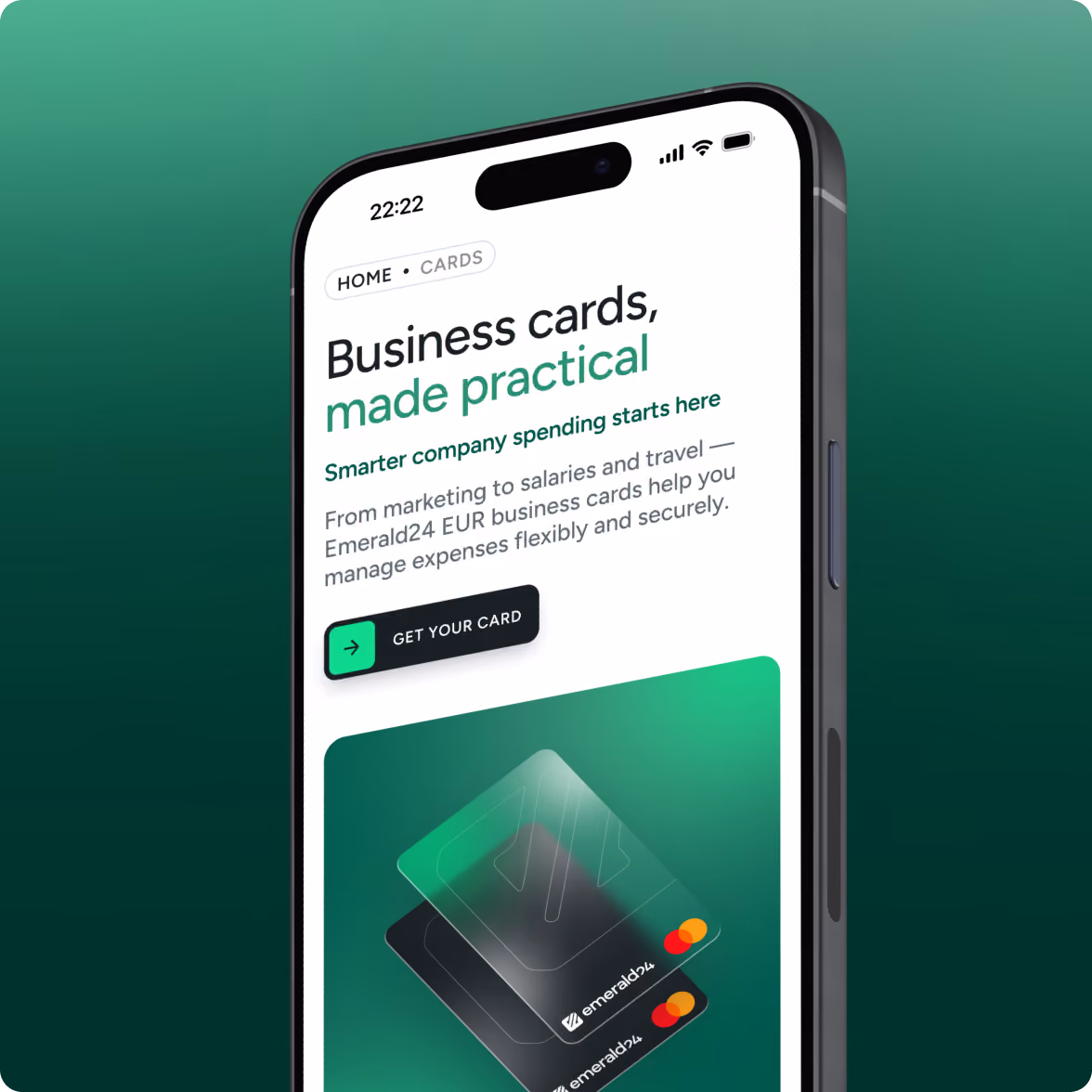 Smartphone screen displaying a business card service page with text promoting practical business cards for managing company expenses, and an image of two Emerald24 branded Mastercard cards.