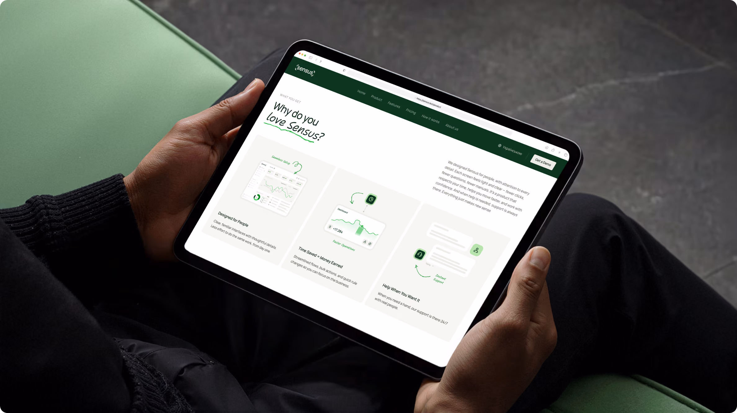 Person holding a tablet displaying a webpage titled 'Why do you love Sensus?' The page features three sections with icons and brief text explaining benefits like suggested people, time saved, and help when stuck, all on a light background with a dark green header.