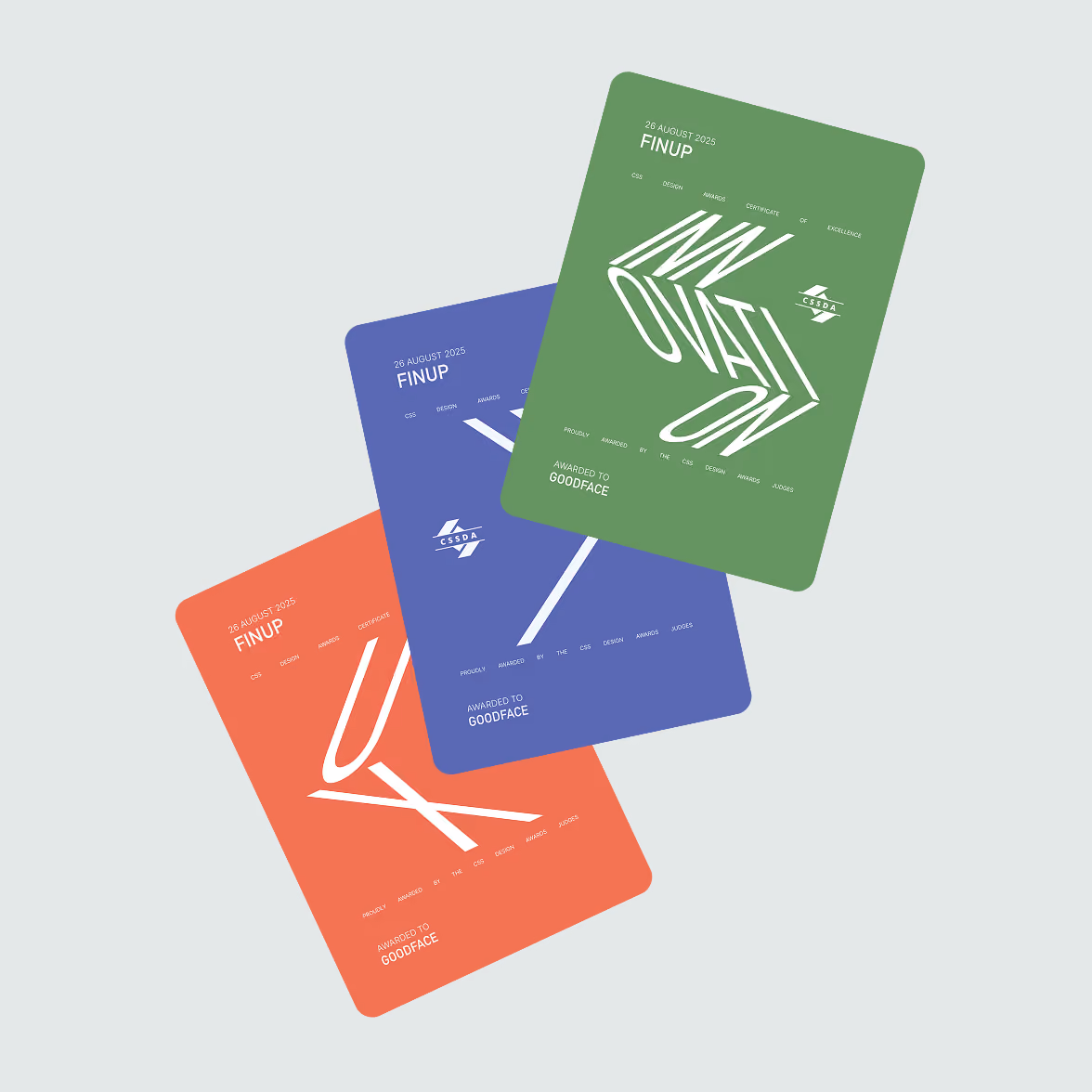 Three stylized certificate cards in red, blue, and green, each labeled FINUP with a date of 26 August 2025; awarded to Goodface, featuring abstract white typography and the CSSDA logo.