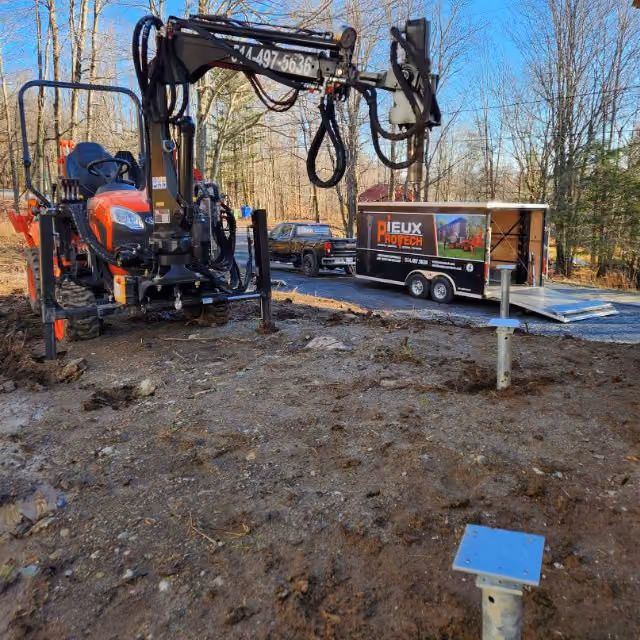 Installation de pieux vissés pour terrasse