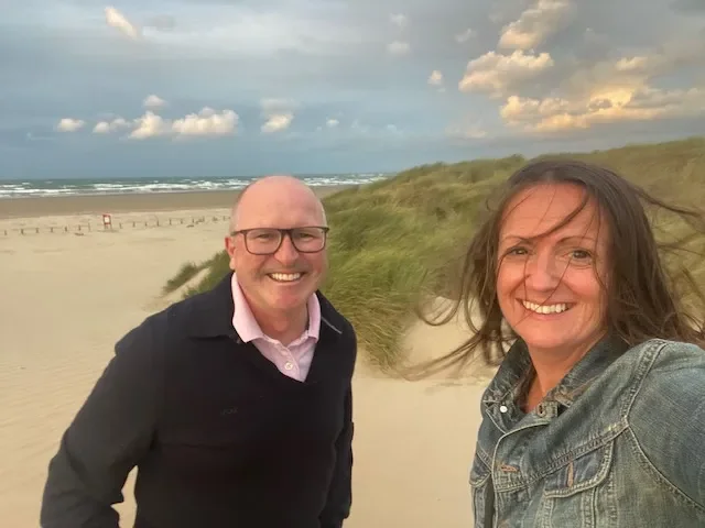 Stephen and a colleague on the beach on a visit with Haven, 2026