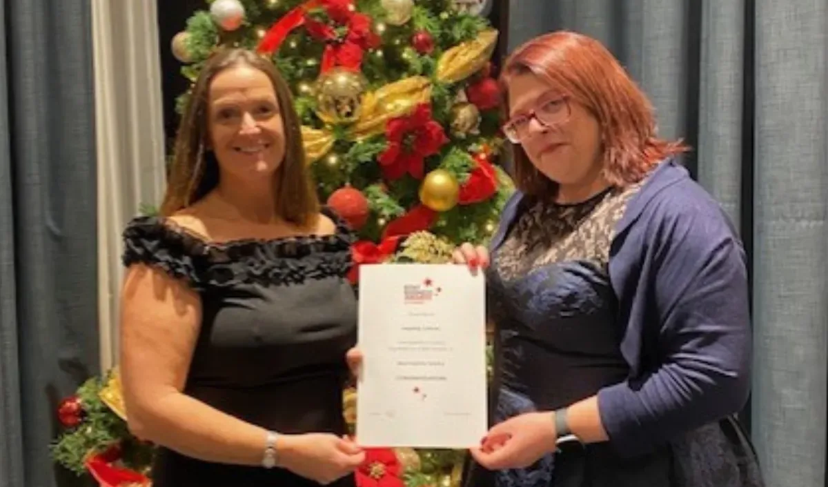 ICL team members with a certificate at the Kent Business Awards, 2025