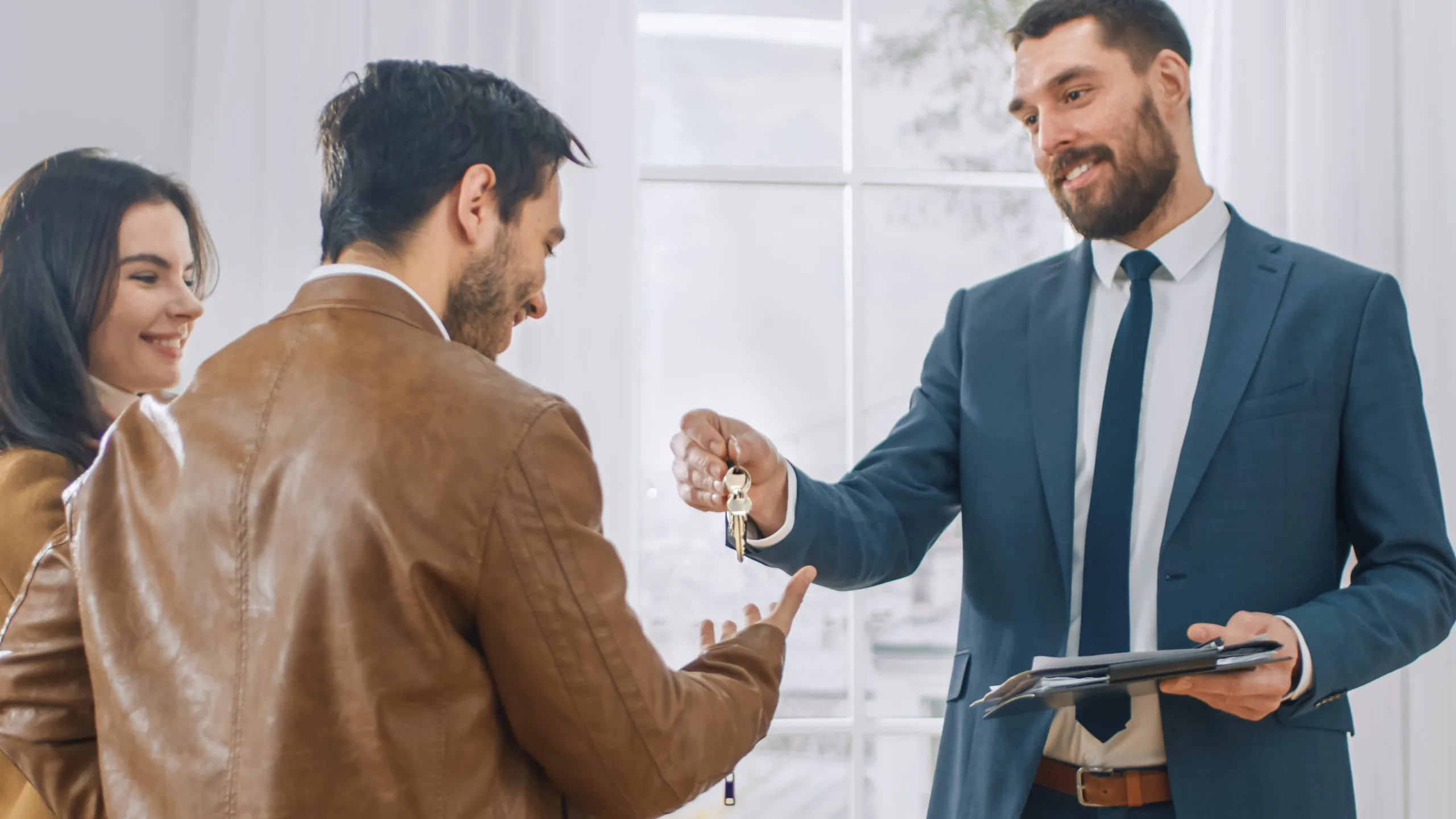Professional Real Estate Agent in Bright New Apartment Gives Key