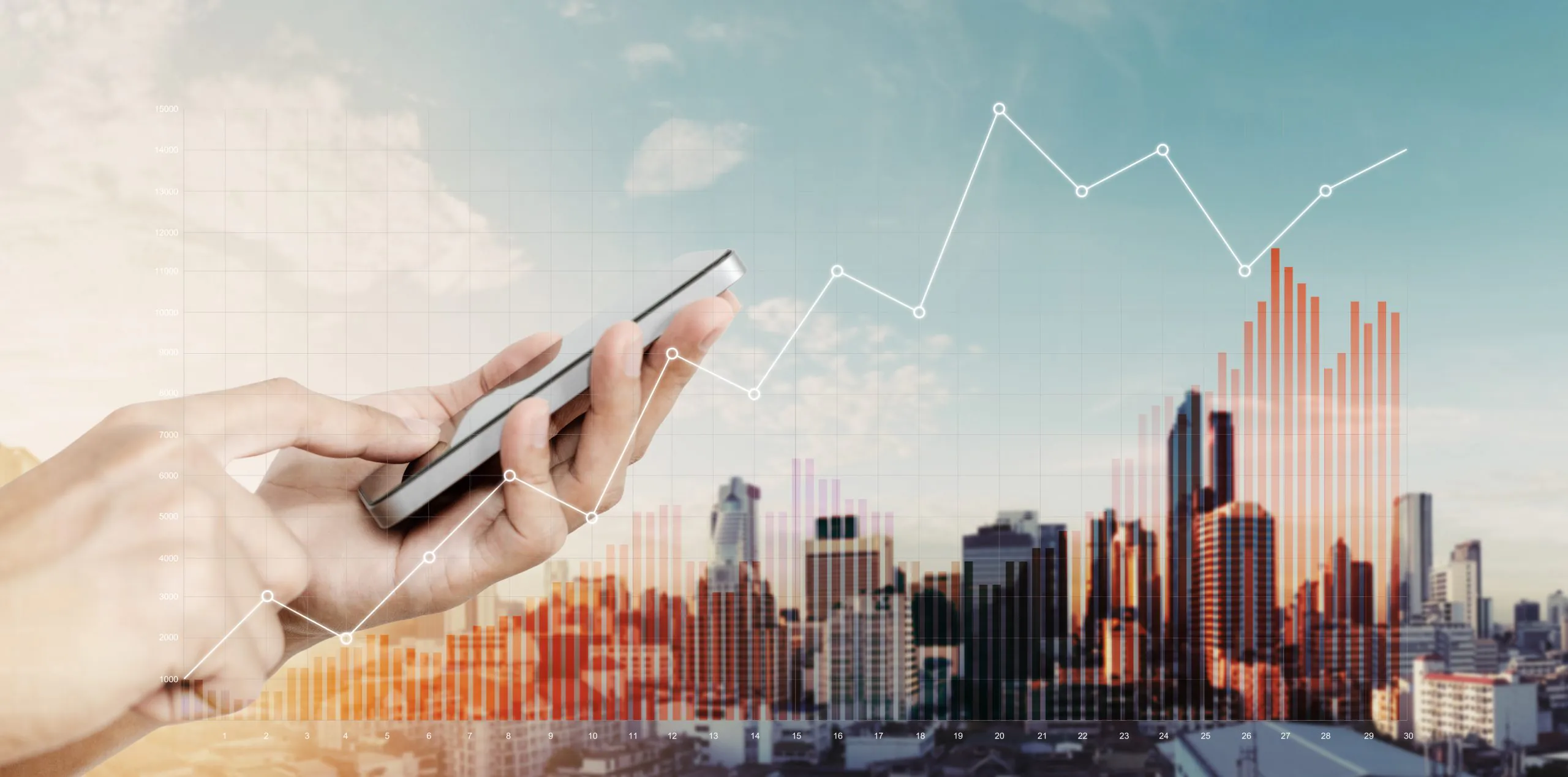 Hand holding mobile smart phone with raising financial graphs, o