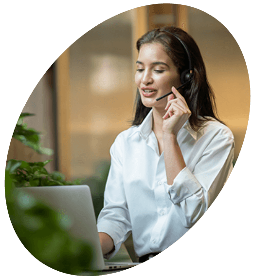 Support representative wearing a headset while working on a laptop