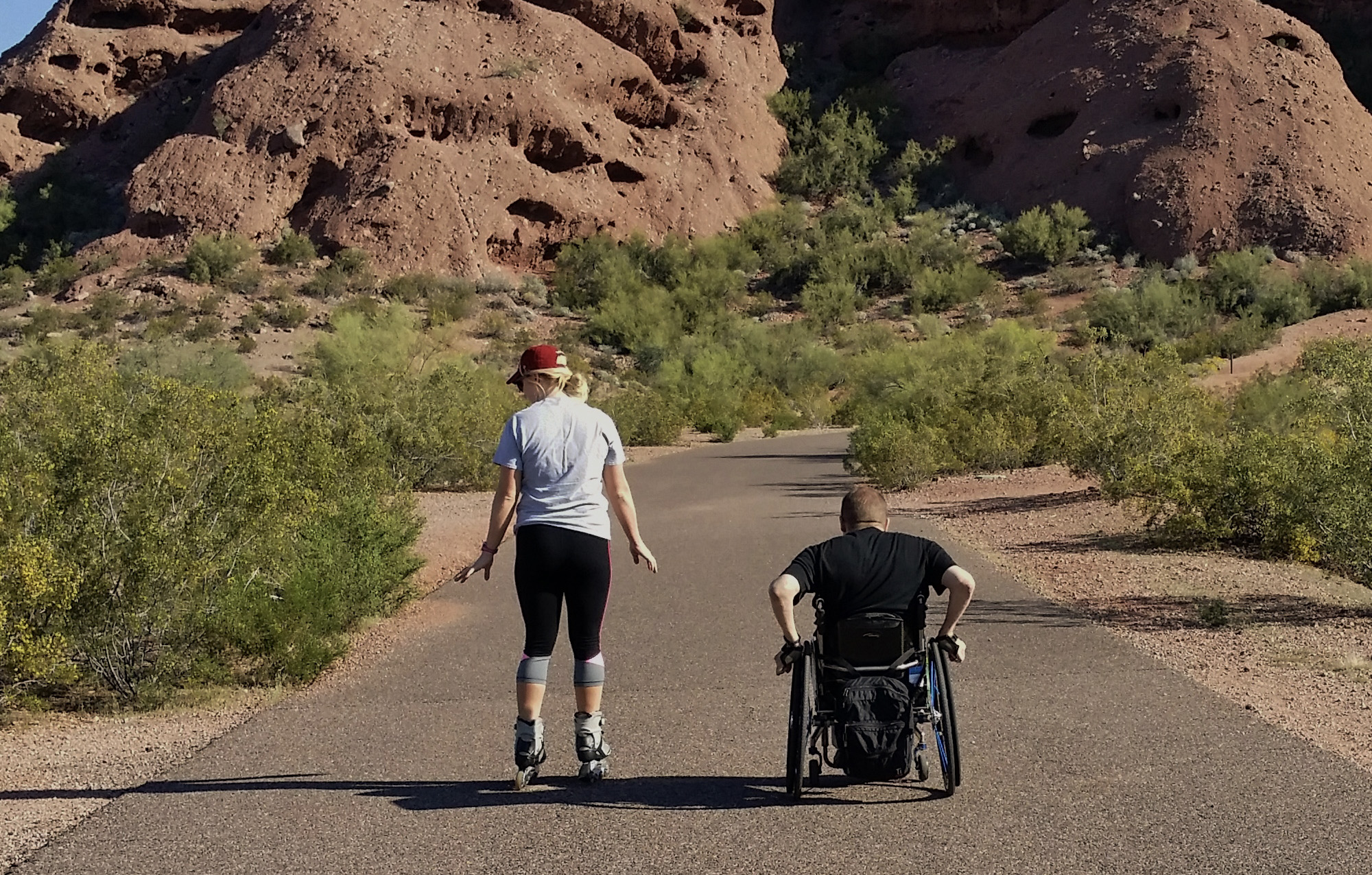 Nick and caregiver near red rocks