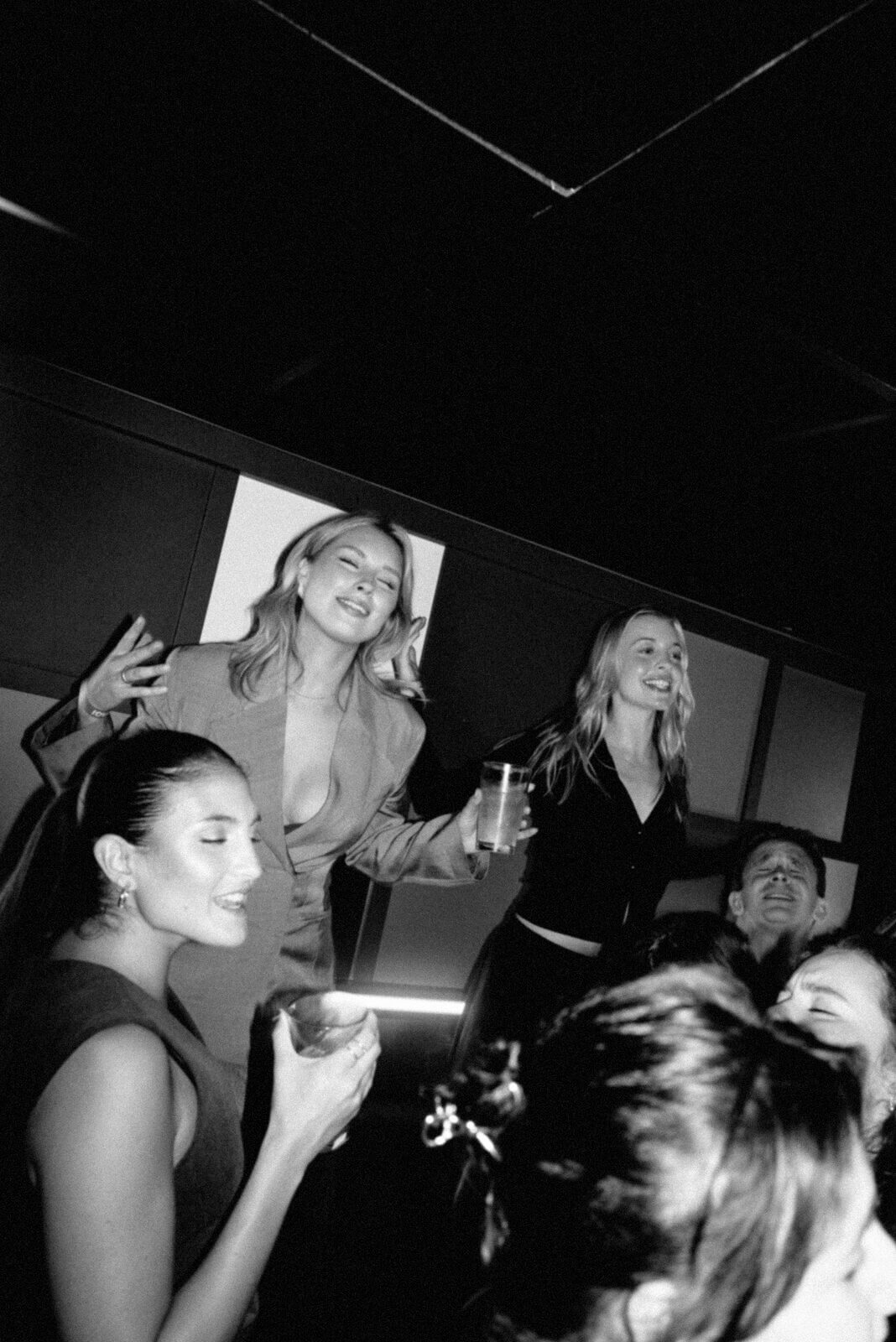 Friends celebrating in a private karaoke room at Moyagi London
