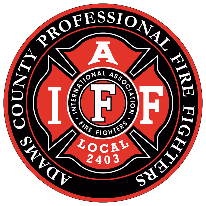 Adams County Professional Fire Fighters circular emblem with I A F F and Local 2403 text.