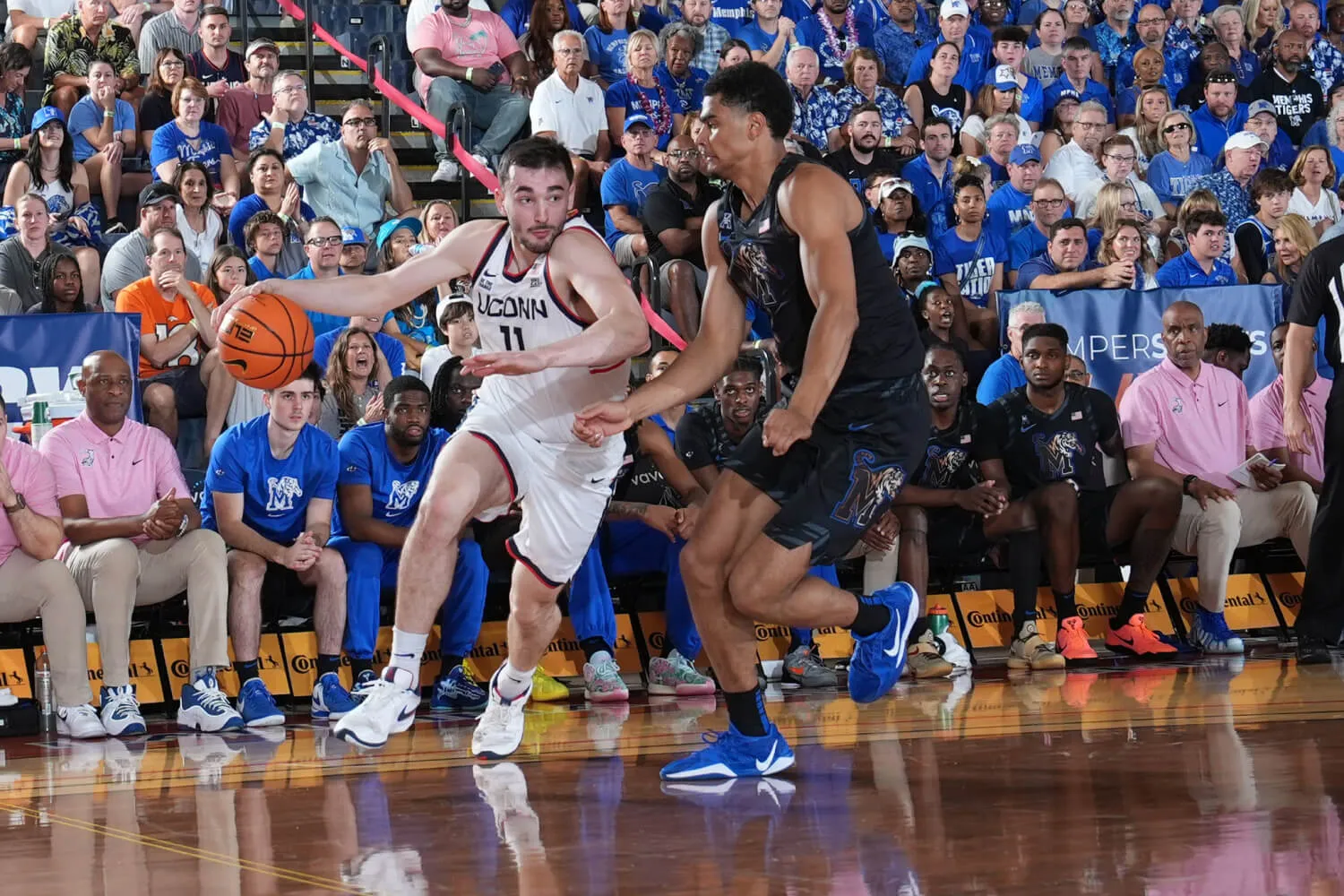 two basketball players at basket ball game