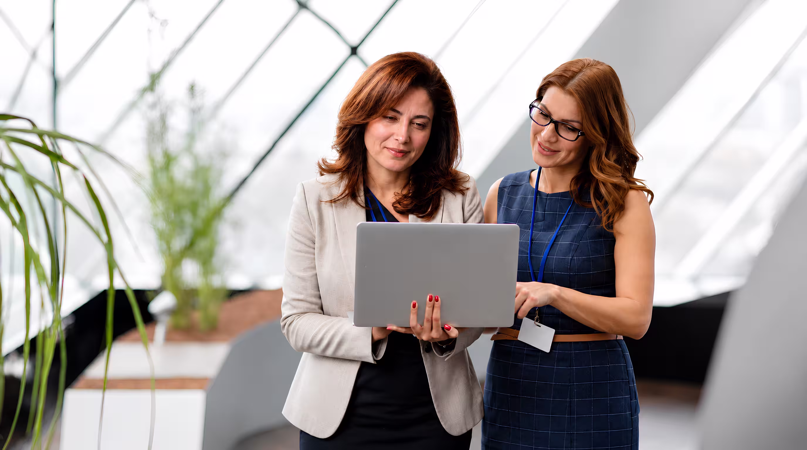 Financial advisory dashboard and market analytics displayed on digital devices in a modern office environment