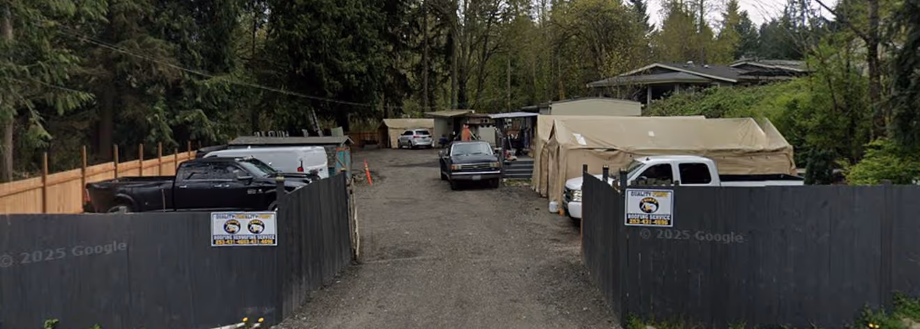 Roofing service image showing residential roof work.