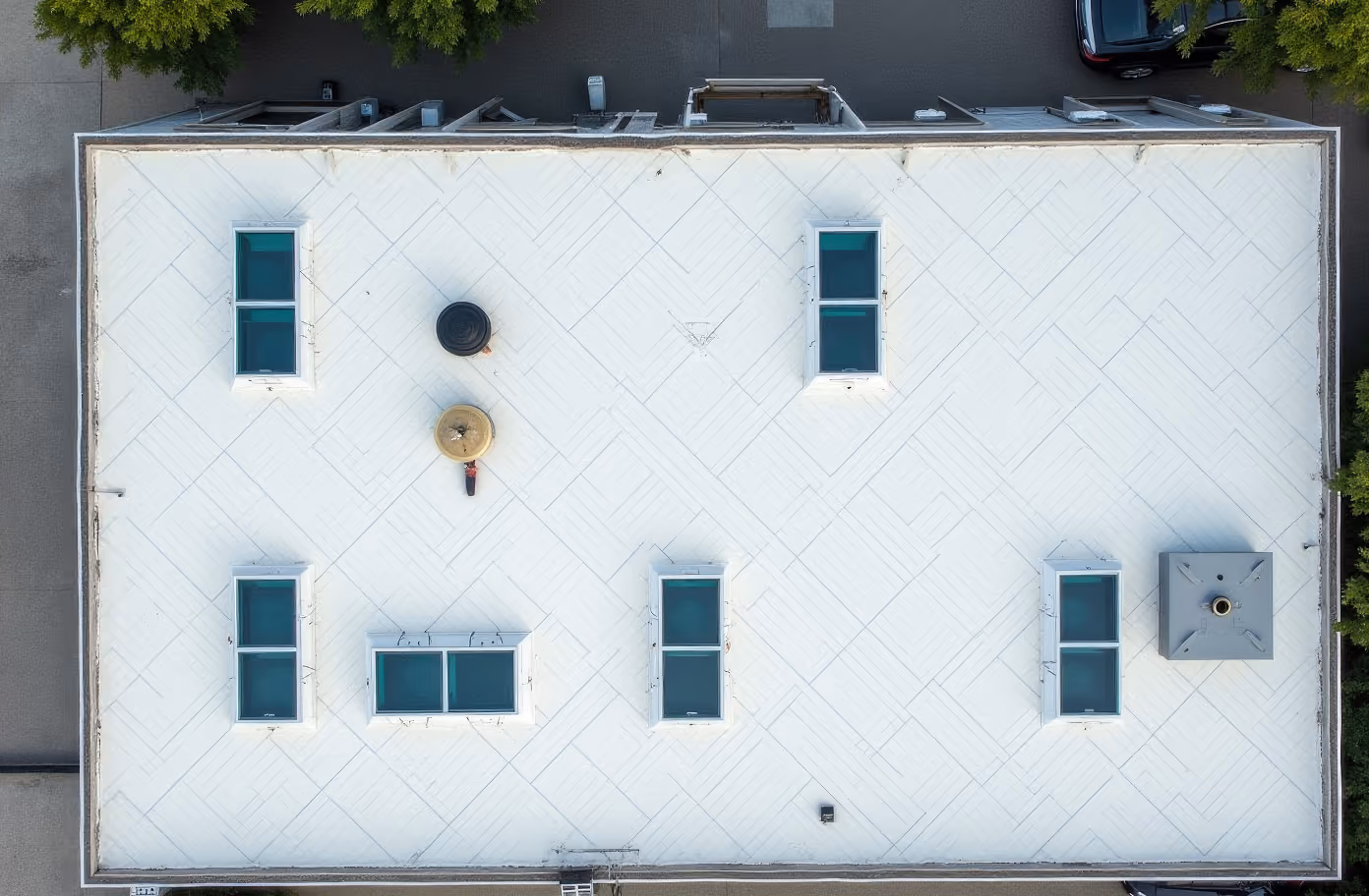 Aerial view of a modern flat roof with skylights.