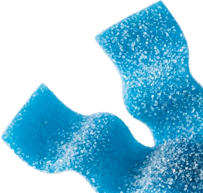 Close-up of blue sour gummy candy strips coated with sugar crystals.