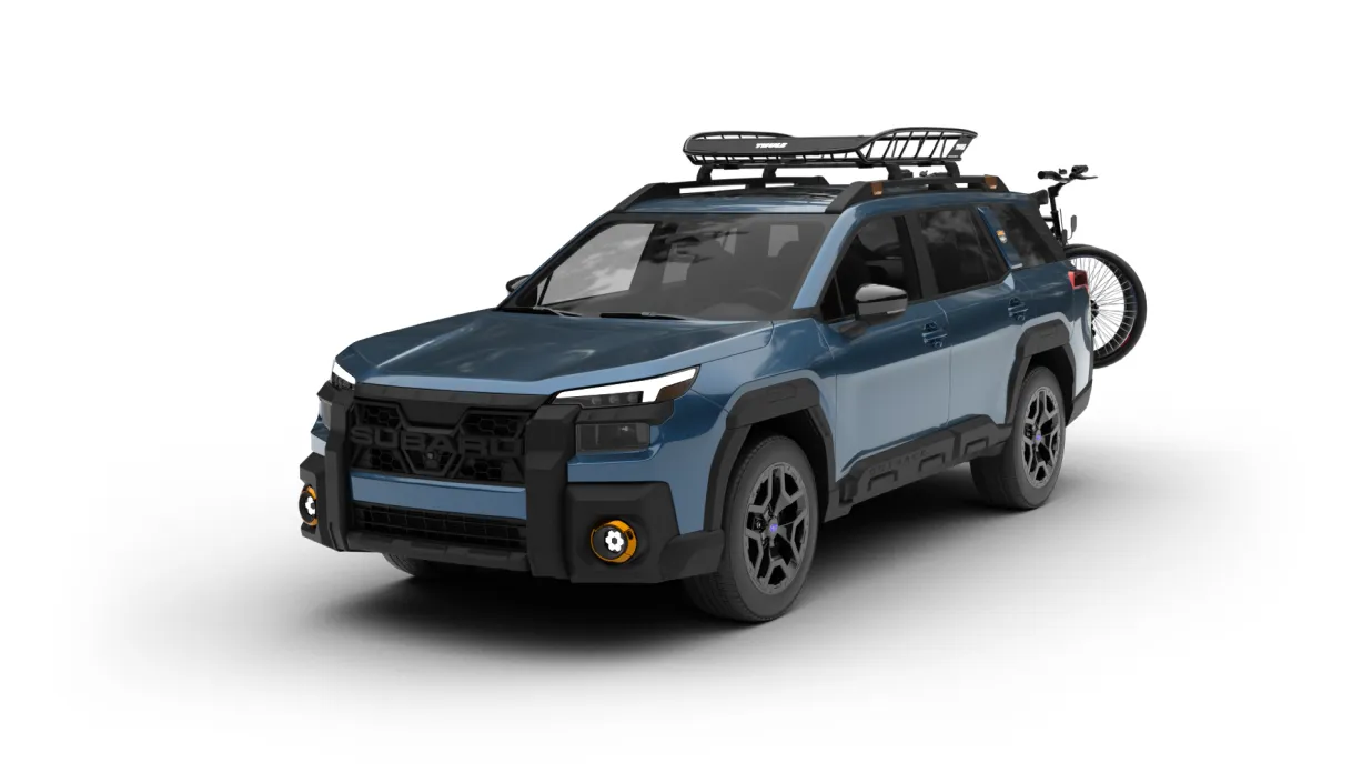 Subaru Outback Wilderness equipped with roof rack, bike carrier, and accessories