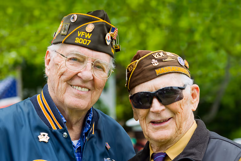 Image of two uniformed veterans posing for the camera.